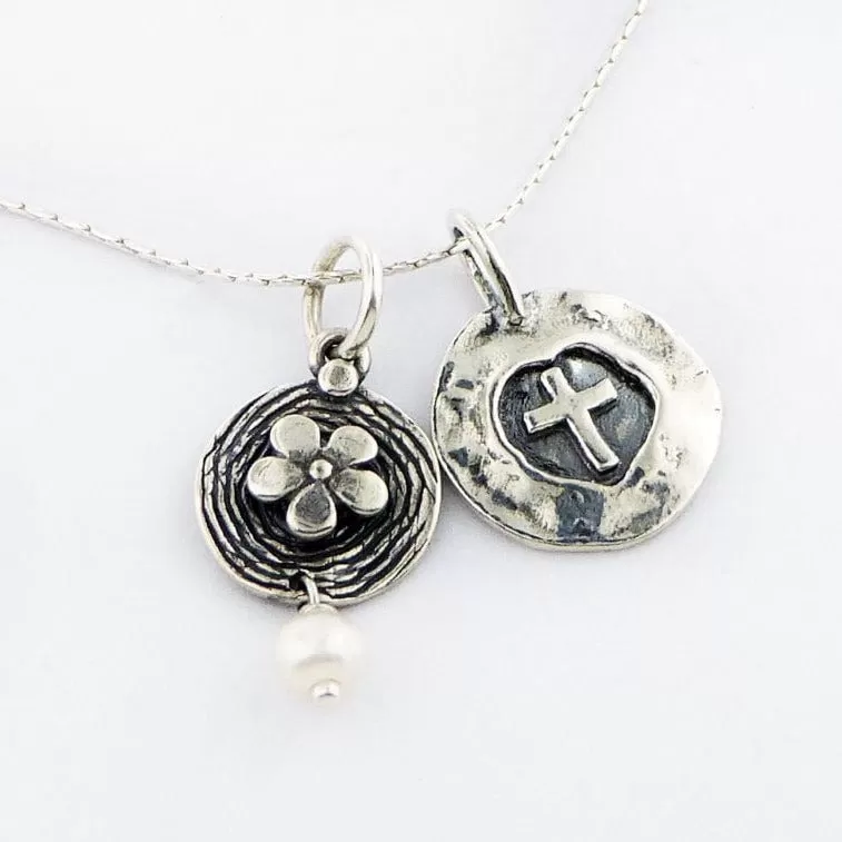 Sterling Silver Necklace for woman set with a cross and a flower charm