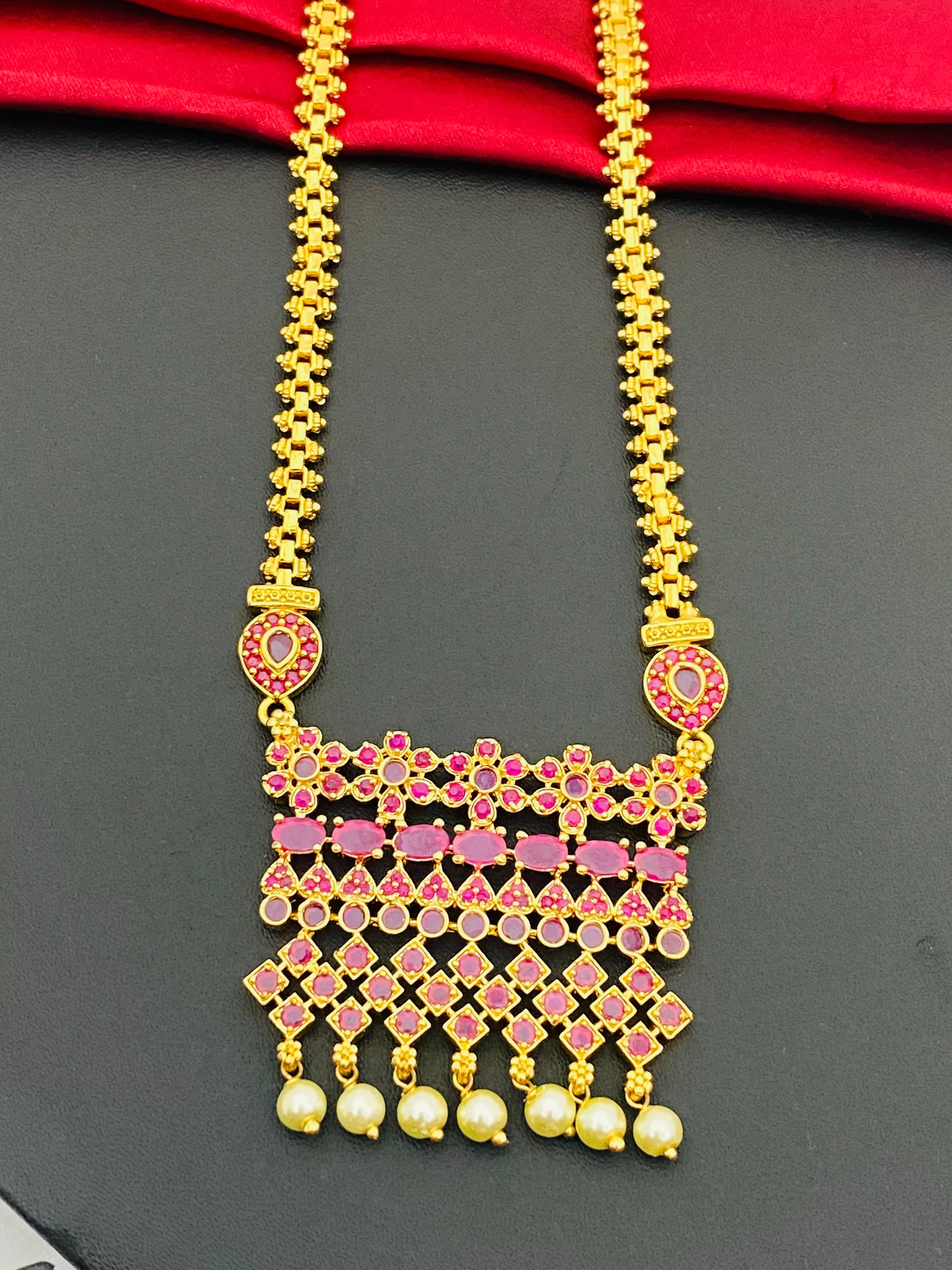 Stunning Ruby Colored Long Chain With Pearl Drops