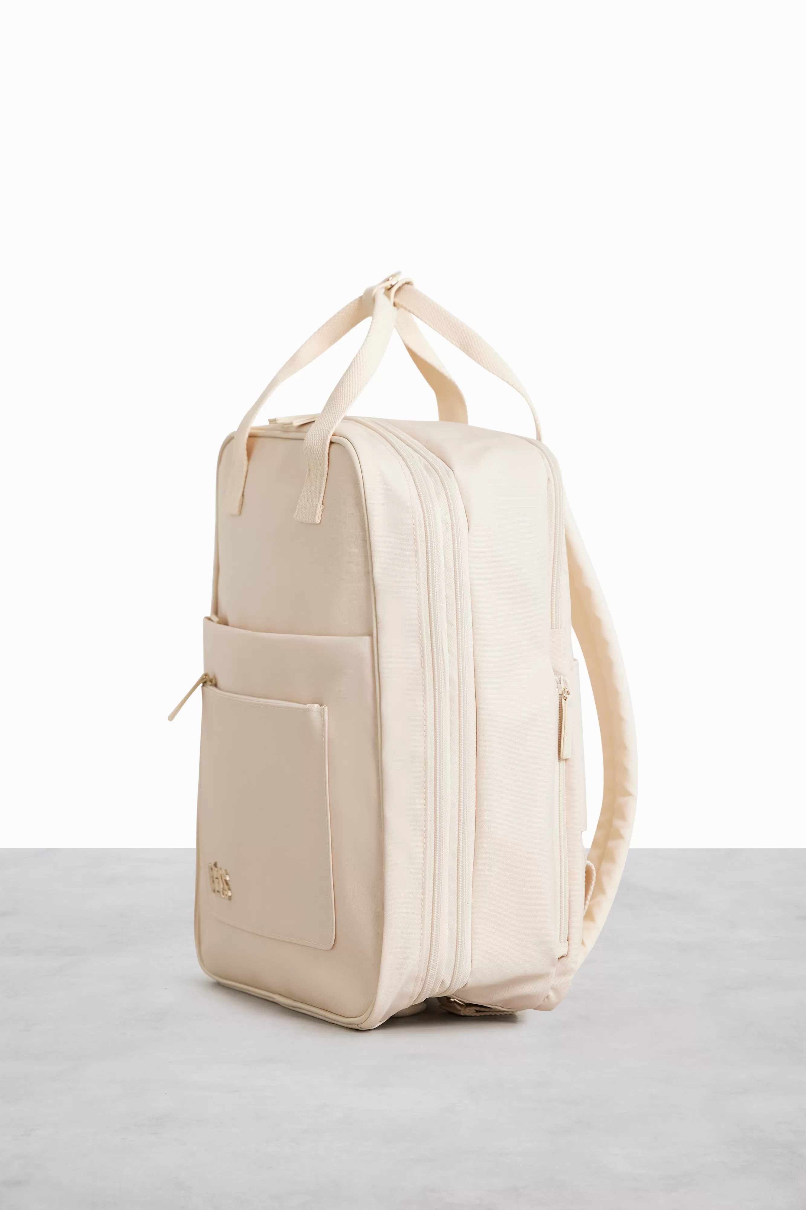 The Expandable Backpack in Beige